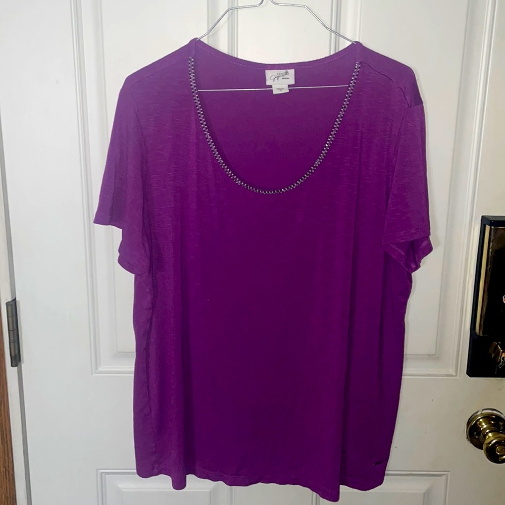 Casual Short Sleeved shirt with beaded accents around the neck.